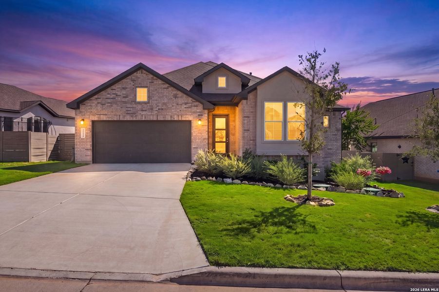 Front exterior of a new home in The Grove at Vintage Oaks, New Braunfels, TX, highlighting curb appeal (Image 22).