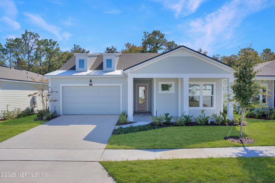 Front exterior of a new home in RiverTown - WaterSong, St. Johns, FL, highlighting curb appeal (Image 18). Front exterior of a new home in RiverTown - WaterSong, St. Johns, FL, highlighting curb appeal (Image 18).