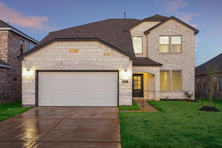 Welcome to 5337 Camerford Court, this stunning two-story brick and stone elevation! With its clean lines, modern lighting, and an inviting curb appeal, this home offers a perfect blend of elegance and comfort. The well-maintained front lawn and extended driveway complement the spacious 2-car garage.