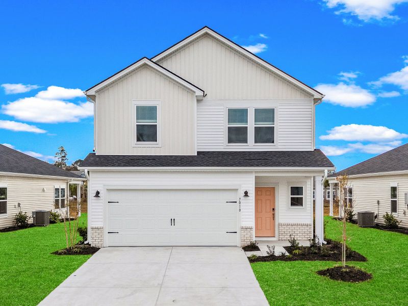 Front exterior of a new home in Clear Pond - The Boardwalk Series, Myrtle Beach, SC, highlighting curb appeal (Image 1). Front exterior of a new home in Clear Pond - The Boardwalk Series, Myrtle Beach, SC, highlighting curb appeal (Image 1).