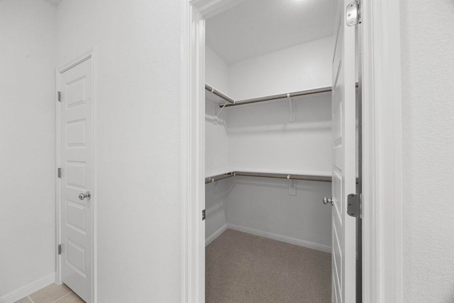 Primary Closet in the Cypress home plan by Trophy Signature Homes - REPRESENTATIVE PHOTO Primary Closet in the Cypress home plan by Trophy Signature Homes - REPRESENTATIVE PHOTO