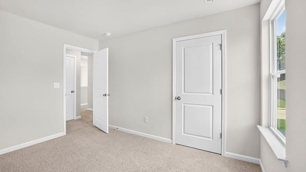 Spacious, unfurnished interior of a new home in Bentley Park, Greenwood (Image 25).