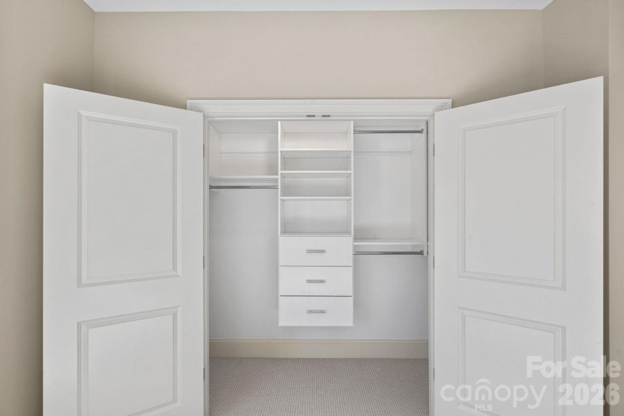 Each of the bedrooms have generous-sized walk-in closets with custom solid shelving - NO WIRE!