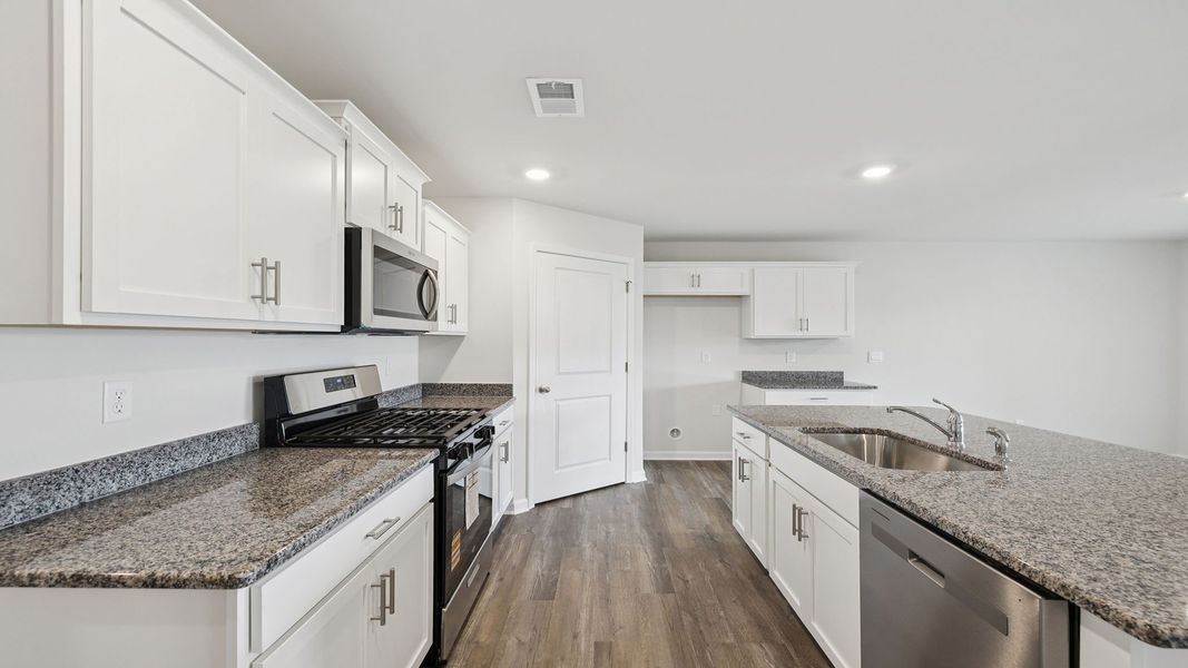 Furnished interior view inside a new home in Bentley Park, Greenwood (Image 7).