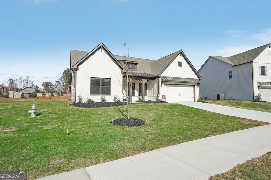 Front exterior of a new home in Summerlin, Winder, GA, highlighting curb appeal (Image 25).