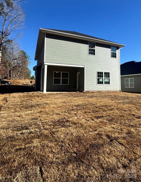 Rear of the home and yard