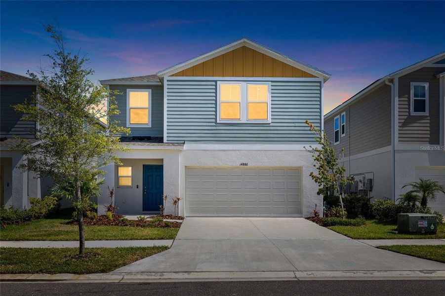 Front exterior of a new home in New Home Communities Near Tampa, Ocala, and Orlando, Florida, Lithia, FL, highlighting curb appeal (Image 2). Front exterior of a new home in New Home Communities Near Tampa, Ocala, and Orlando, Florida, Lithia, FL, highlighting curb appeal (Image 2).