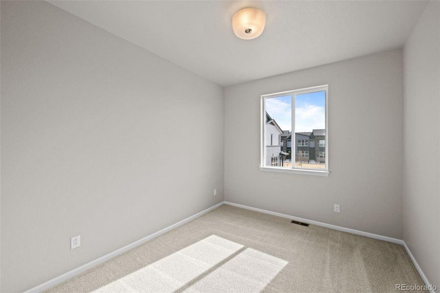 Spacious, unfurnished interior of a new home in Ralston Creek, Arvada (Image 31).
