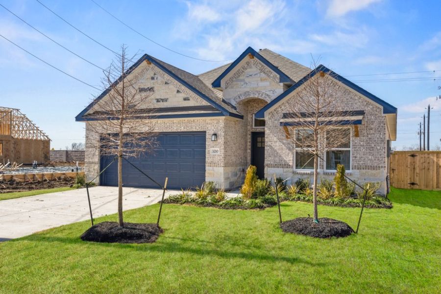 Front exterior of a new home in Ashland, Houston, TX, highlighting curb appeal (Image 20).