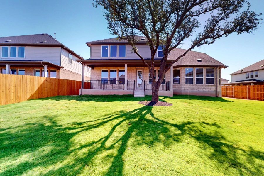 Front exterior of a new home in Edgewood, Leander, TX, highlighting curb appeal (Image 2). Front exterior of a new home in Edgewood, Leander, TX, highlighting curb appeal (Image 2).