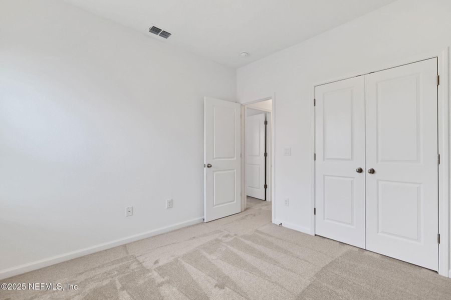 Spacious, unfurnished interior of a new home in TrailMark, St. Augustine (Image 35).