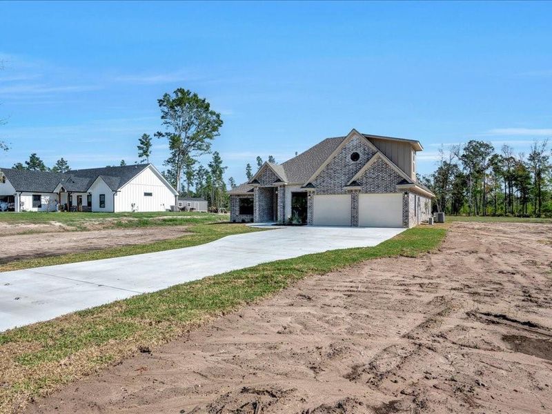 Front exterior of a new home in , Diboll, TX, highlighting curb appeal (Image 24). Front exterior of a new home in , Diboll, TX, highlighting curb appeal (Image 24).