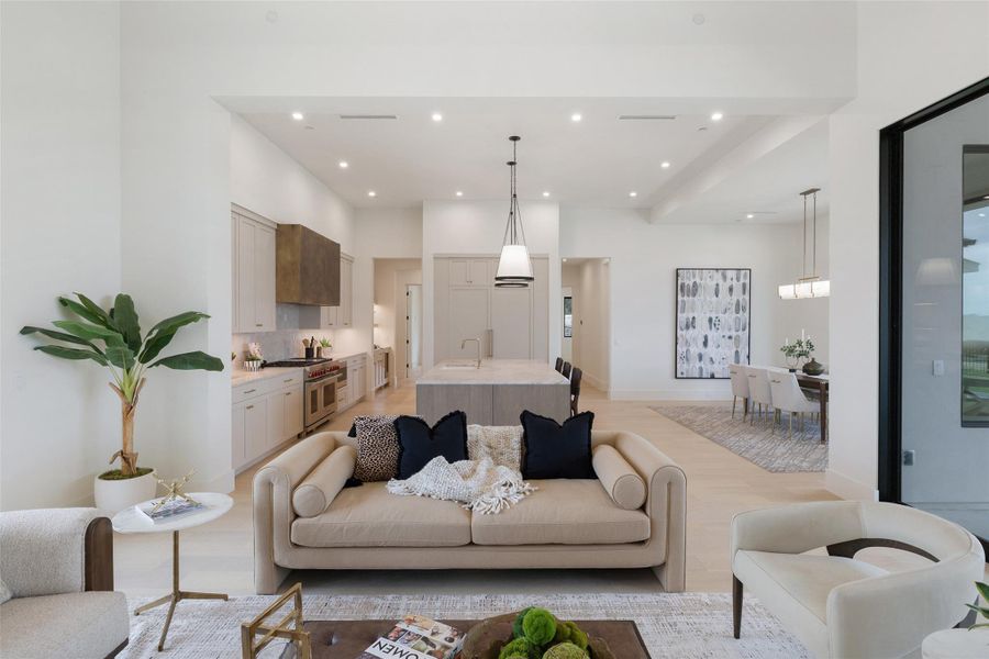 Living room with recessed lighting and light wood-style floors Living room with recessed lighting and light wood-style floors