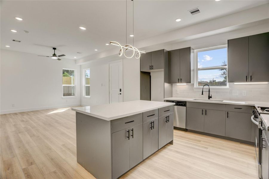 The kitchen island has elegant LED lighting.