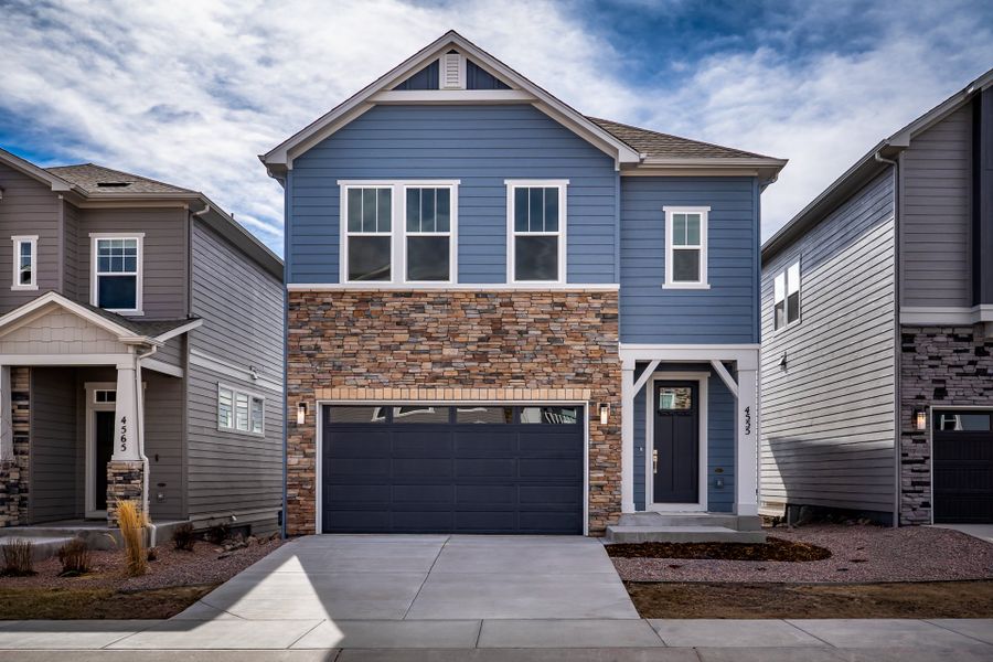Front exterior of a new home in Trailside at Cottonwood Creek, Colorado Springs, CO, highlighting curb appeal (Image 1). Front exterior of a new home in Trailside at Cottonwood Creek, Colorado Springs, CO, highlighting curb appeal (Image 1).