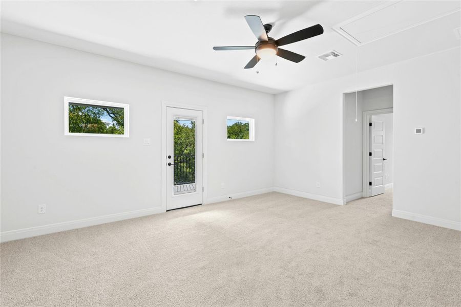 Upstairs game room with door to large 2nd floor covered patio. Upstairs game room with door to large 2nd floor covered patio.