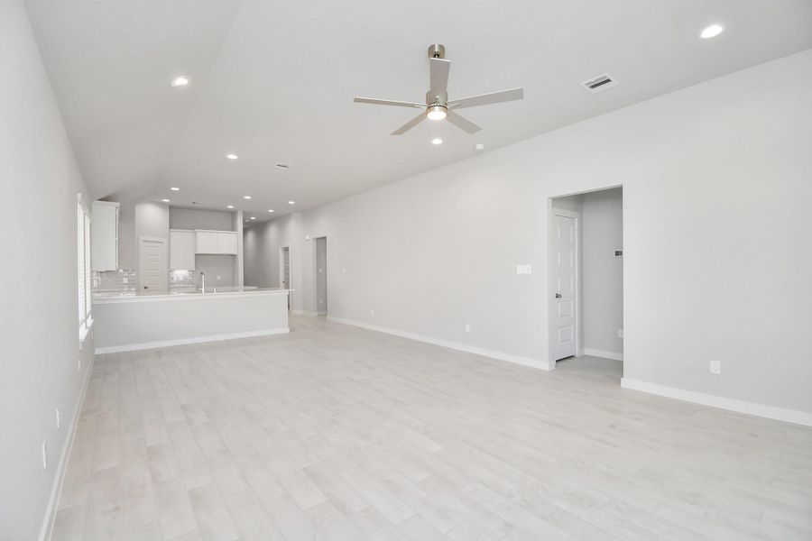 View from the family room to the kitchen and dining area! Sample photo of completed home with similar floor plan. Actual colors and selections may vary. View from the family room to the kitchen and dining area! Sample photo of completed home with similar floor plan. Actual colors and selections may vary.
