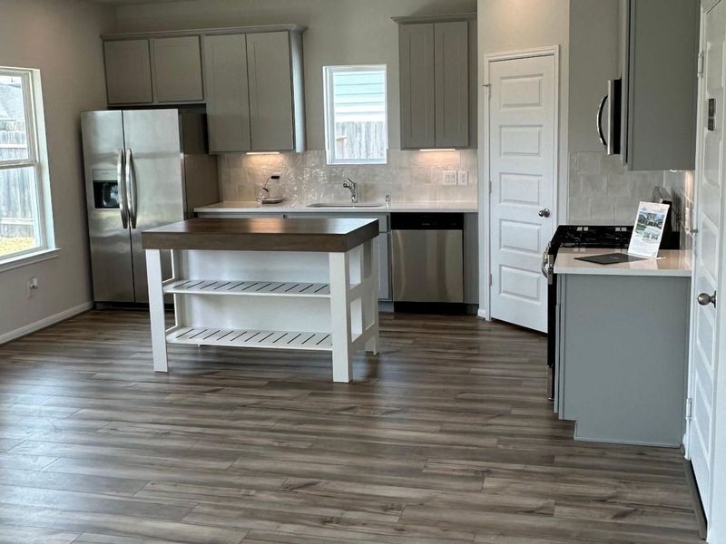 Furnished interior view inside a new home in Hill & Dale Ranch, Splendora (Image 6).