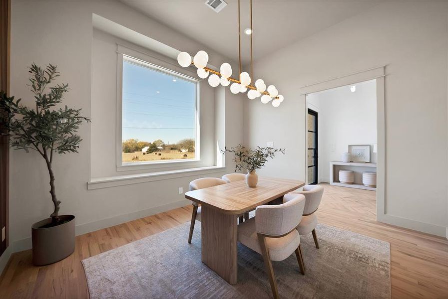 Dining area with light wood finished floors