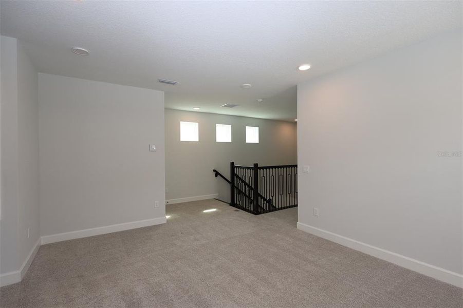 Spacious, unfurnished interior of a new home in Lake Star at Ovation, Winter Garden (Image 30).