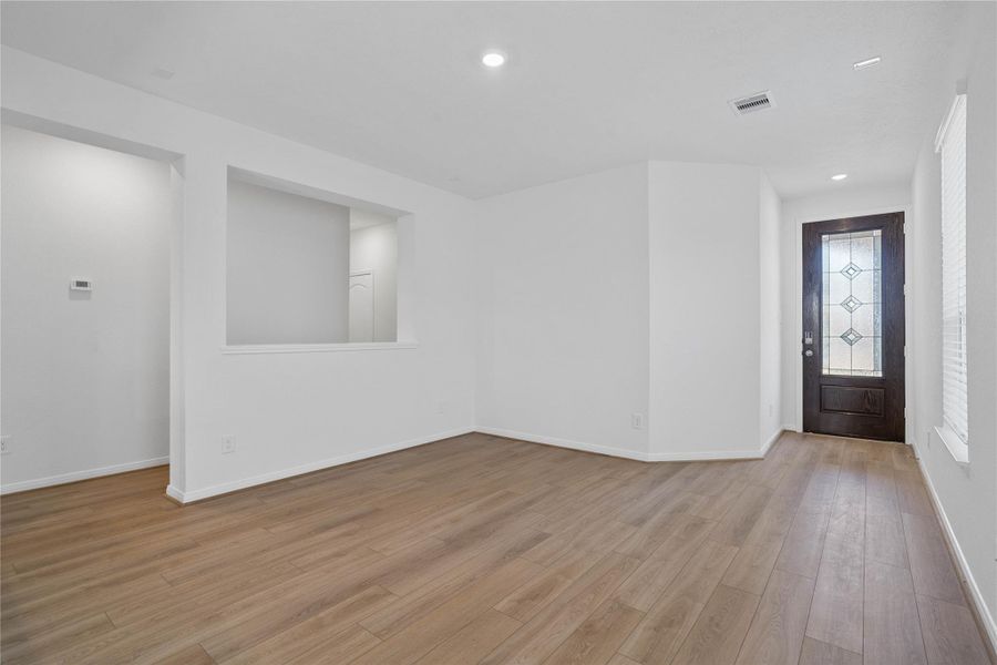 Step into your new home at 22862 Magnolia Haven and be greeted by Bandera vinyl plank flooring in French Oak, a stunning front door with decorative Pembridge Glass, and fresh, bright paint—all coming together to create a warm and welcoming entryway. Step into your new home at 22862 Magnolia Haven and be greeted by Bandera vinyl plank flooring in French Oak, a stunning front door with decorative Pembridge Glass, and fresh, bright paint—all coming together to create a warm and welcoming entryway.