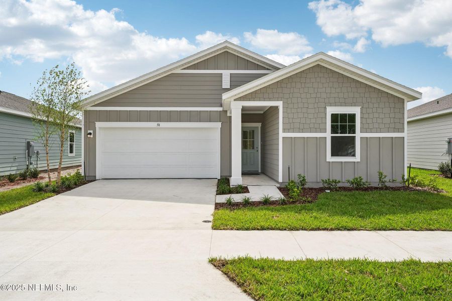Front exterior of a new home in , Palm Coast, FL, highlighting curb appeal (Image 1). Front exterior of a new home in , Palm Coast, FL, highlighting curb appeal (Image 1).