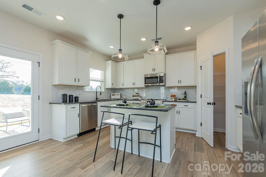 Furnished interior view inside a new home in Green Acres, Concord (Image 5).