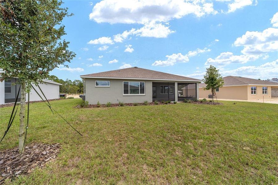 Exterior details and patio area of a home in On Top of the World Communities, Ocala (Image 3).