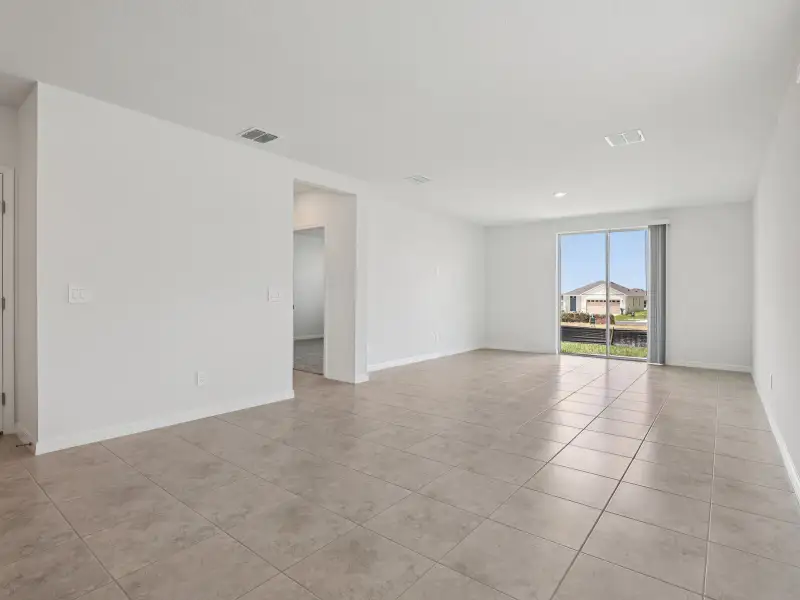 Spacious, unfurnished interior of a new home in The Reserve at Hammock Oaks - Classic Series, Lady Lake (Image 7).