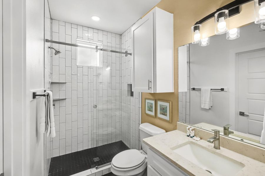 Bathroom with vanity and a stall shower Bathroom with vanity and a stall shower