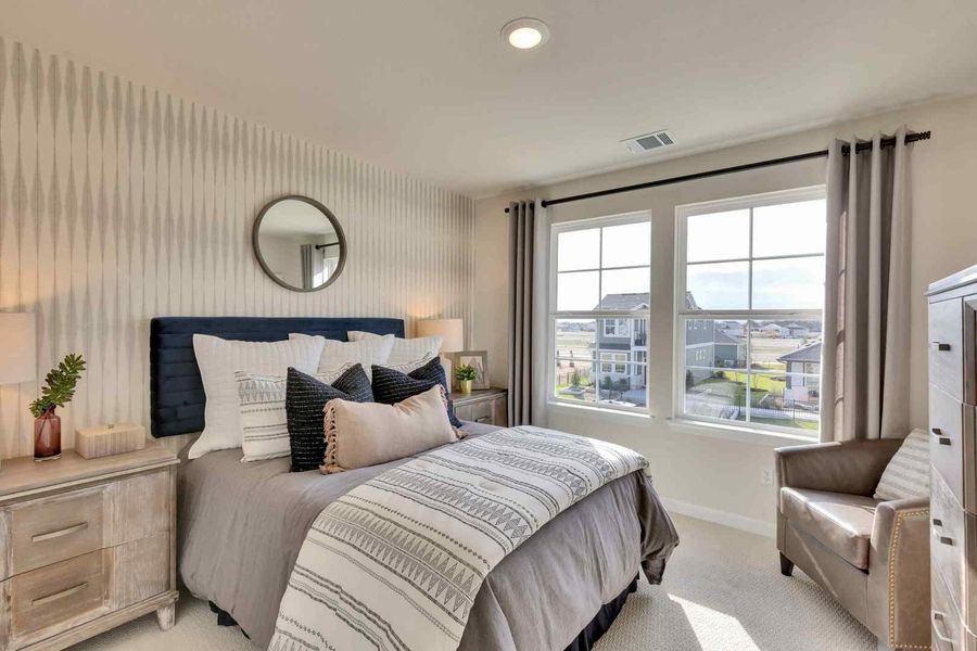 Large multi-pane windows overlook the neighborhood, flooding the carpeted space with natural light. Large multi-pane windows overlook the neighborhood, flooding the carpeted space with natural light.