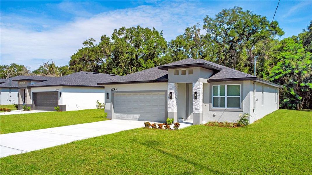 Front exterior of a new home in , Apopka, FL, highlighting curb appeal (Image 22).
