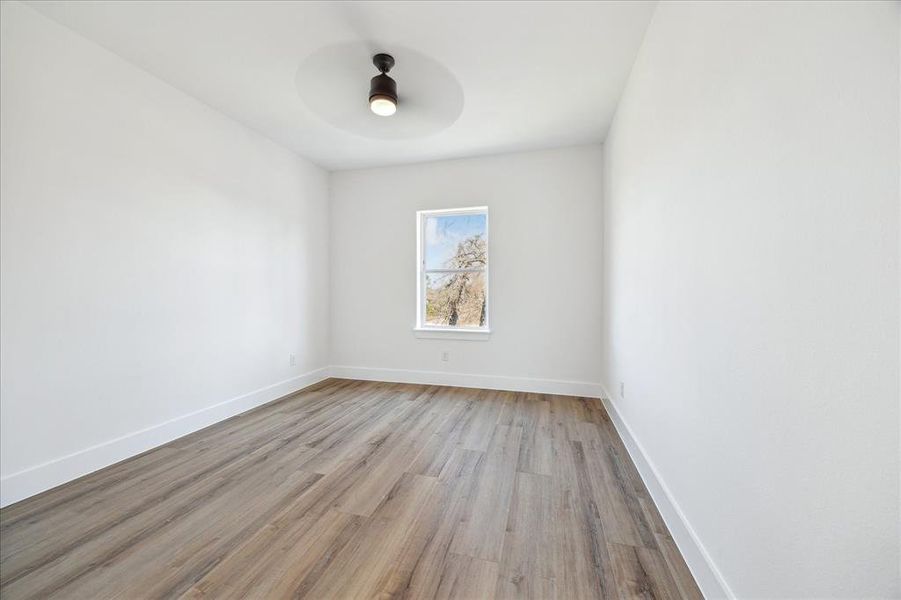 One of two secondary bedrooms on the 3rd level with walk-in closet, jack and jill en-suite bathroom.  Window coverings (not shown) have been installed as an added bonus!