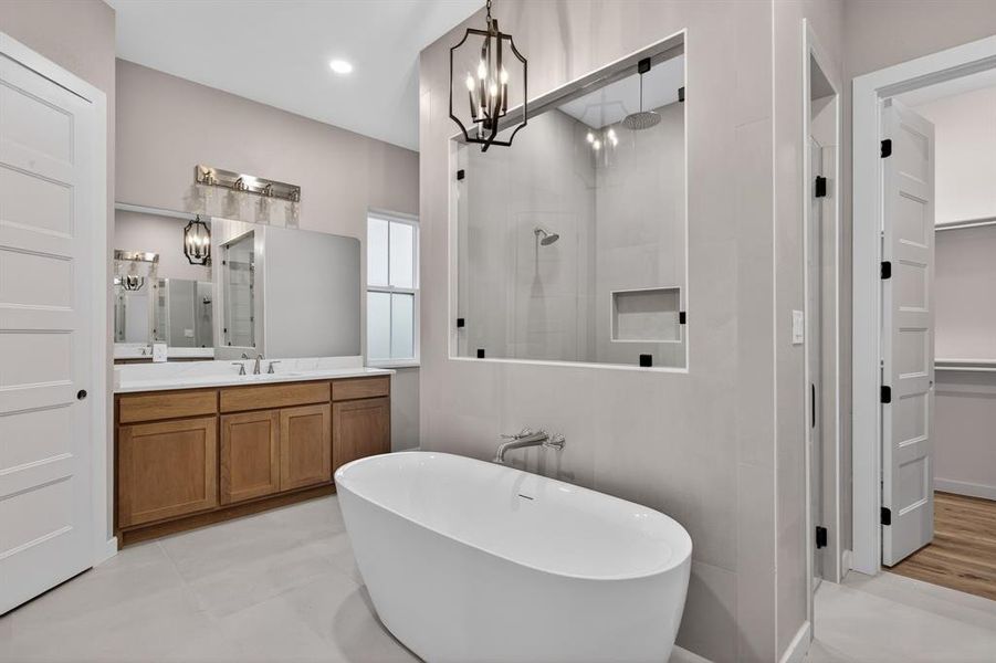 This angle of the primary bathroom shows both the walk-in closet and the storage closet.