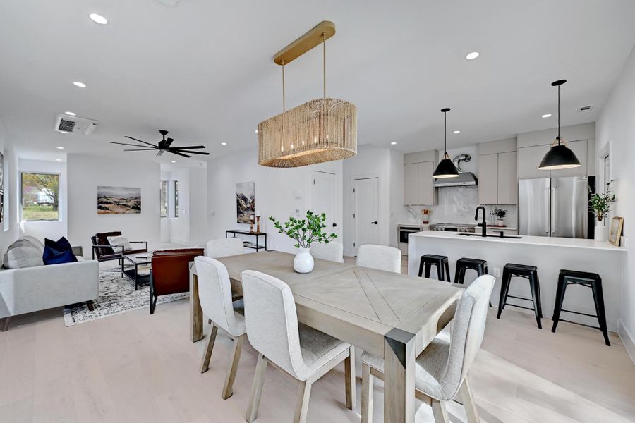 Dining room featuring a ceiling fan, recessed lighting, and light wood-type flooring