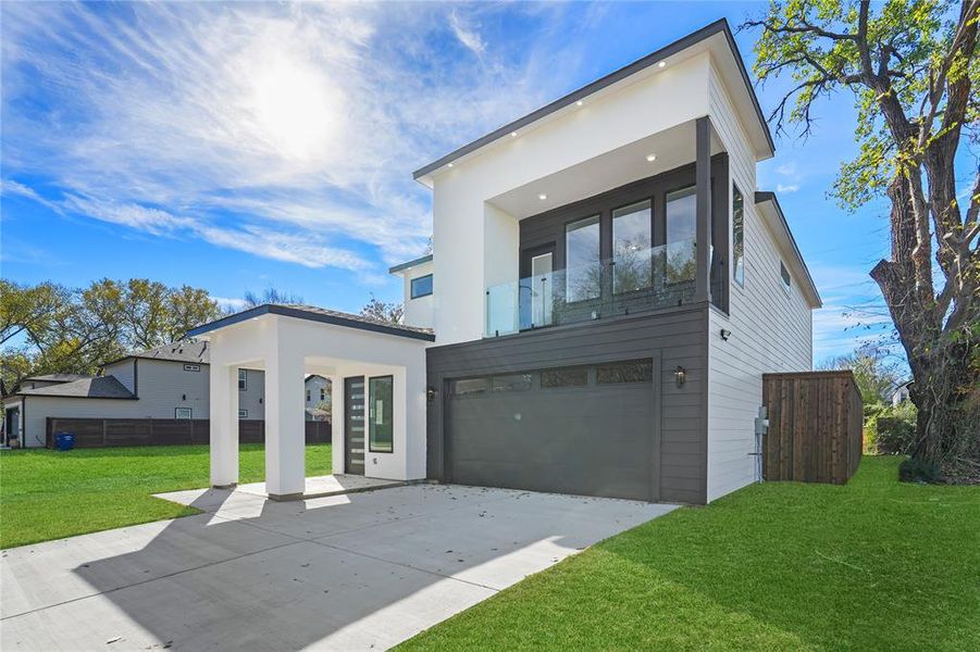 Contemporary home featuring a balcony, concrete driveway, and a garage