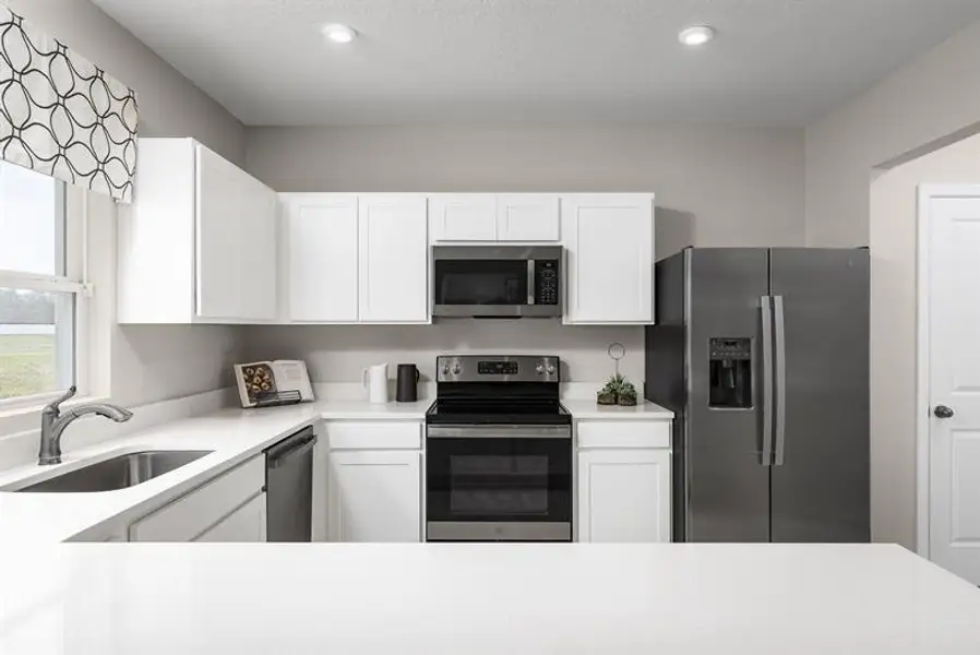 Representative furnished interior of a home built from the Willow by Ryan Homes in Vista Trace, Belleview (Image 3).