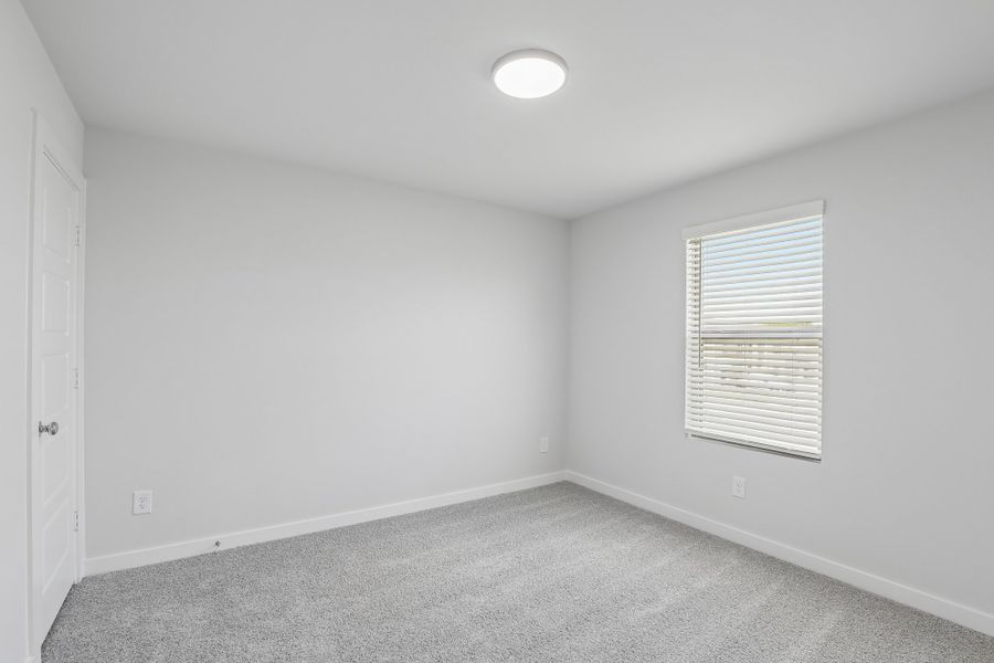Bedroom in the Holden home plan by Trophy Signature Homes