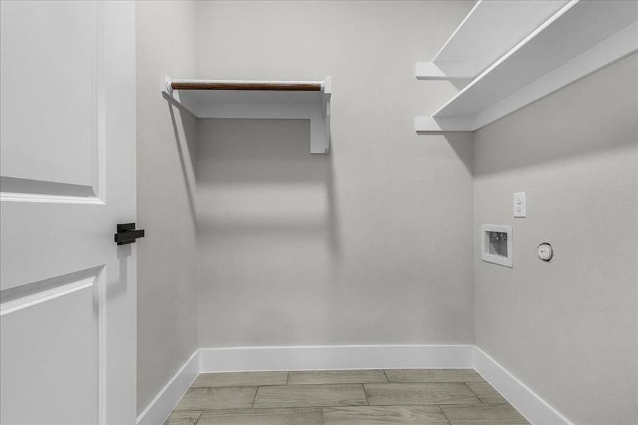 Laundry area featuring gas dryer hookup, laundry area, baseboards, and washer hookup