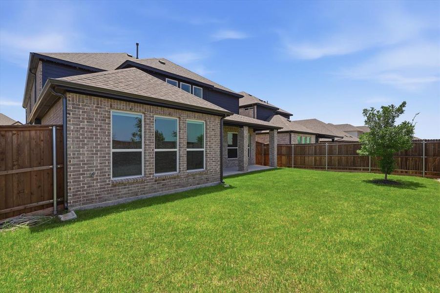 Exterior details and patio area of a home in Valencia on The Lake, Little Elm (Image 4). Exterior details and patio area of a home in Valencia on The Lake, Little Elm (Image 4).