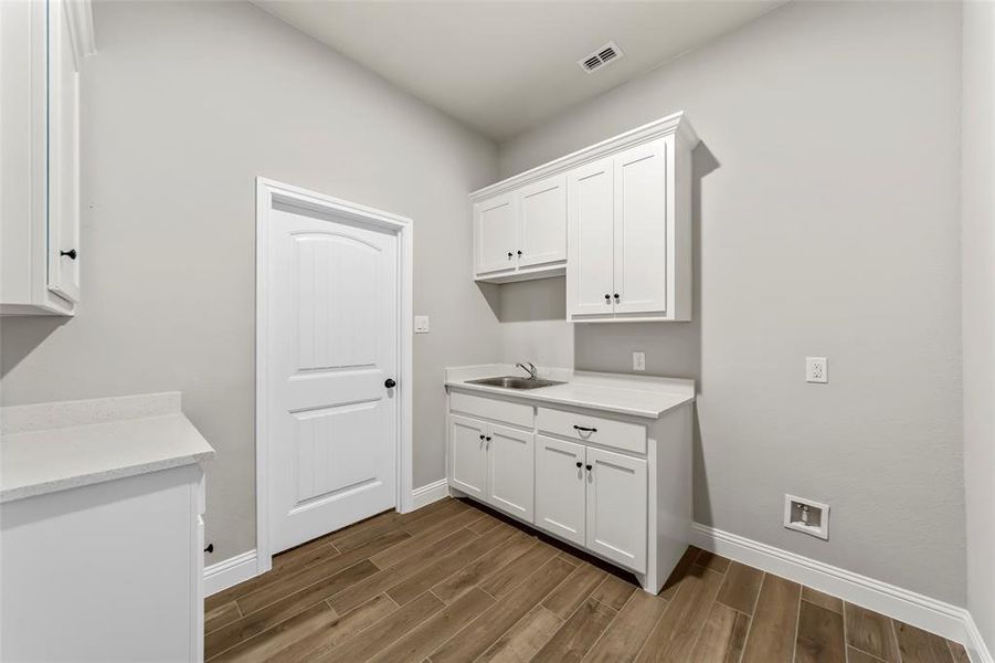 Laundry area with sink