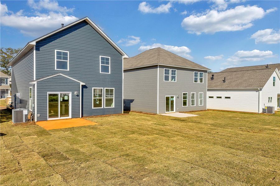 Exterior details and patio area of a home in Brownstone Park, Easley (Image 15).