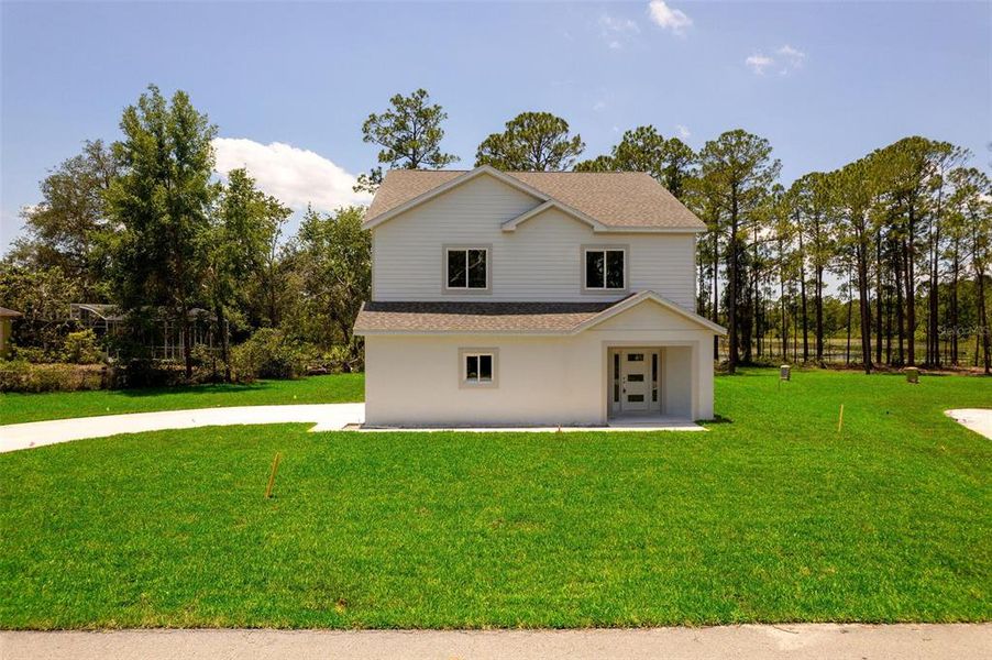 Front exterior of a new home in , Deltona, FL, highlighting curb appeal (Image 2).