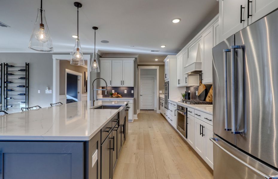 The kitchen offers plenty of space for cooking and gathering, making it the perfect hub for family and friends.