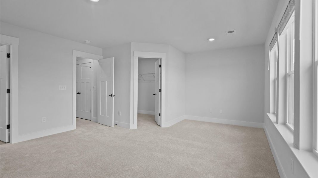 Eye-catching details and elegant finishes in the vibrant primary suite of this select home Eye-catching details and elegant finishes in the vibrant primary suite of this select home