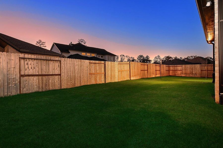 Exterior details and patio area of a home in The Highlands - 65', Porter (Image 2). Exterior details and patio area of a home in The Highlands - 65', Porter (Image 2).