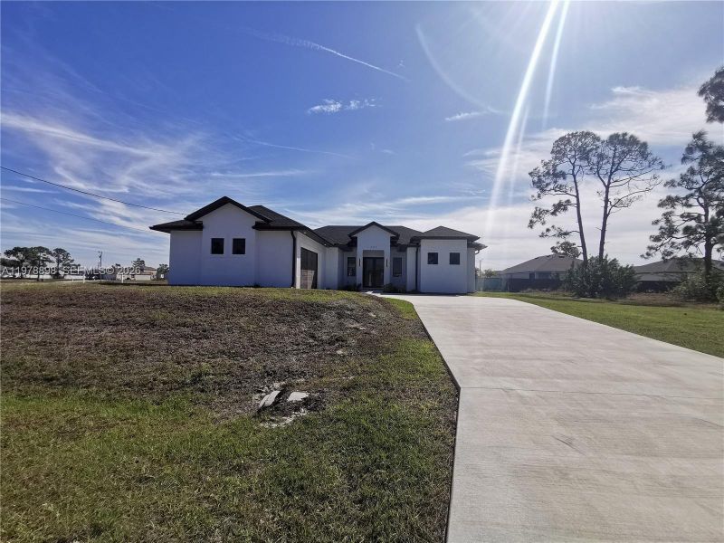 Front exterior of a new home in , Cape Coral, FL, highlighting curb appeal (Image 23).