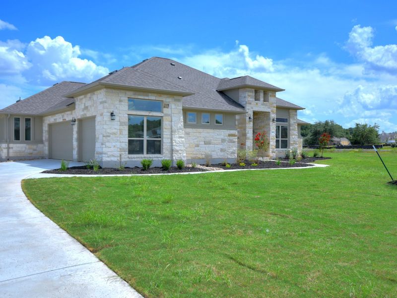 Representative exterior photo of a completed home built from the San Simeon I by Giddens Homes in Clearwater Ranch, Liberty Hill, TX (Image 56).