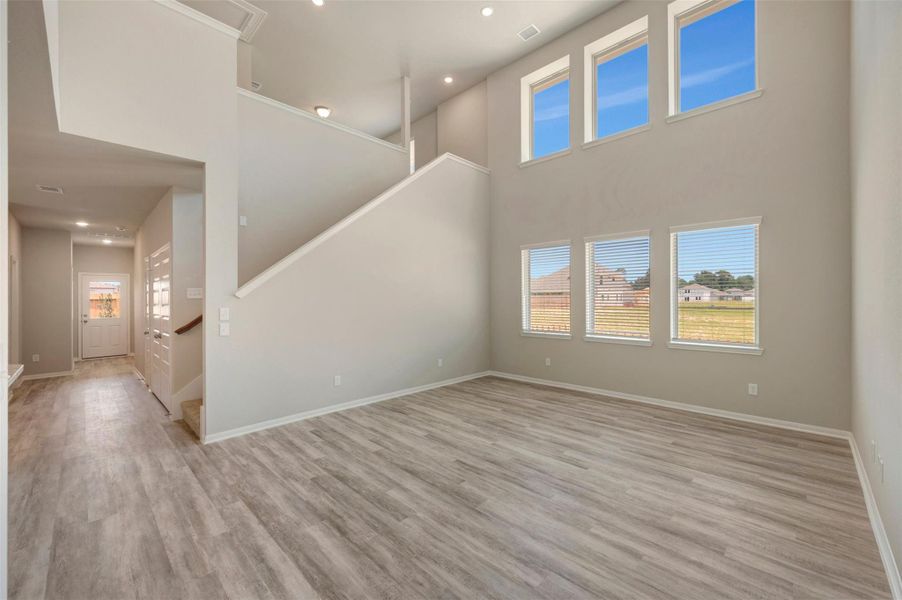 Bright and airy great room with high ceilings (*Photo not of actual home and used for illustration purposes only.)