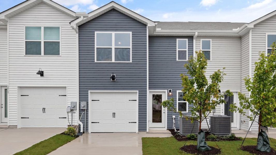 Representative exterior photo of a completed home built from the Pearson ll by D.R. Horton in The Townes at Matthews Landing, Fuquay Varina, NC (Image 25).